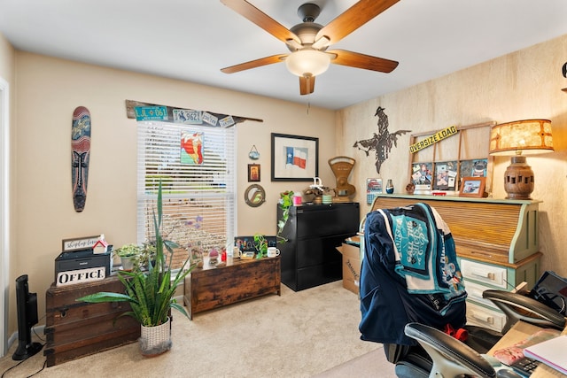 home office with light carpet and ceiling fan