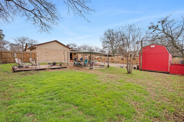 view of yard with a shed and a patio