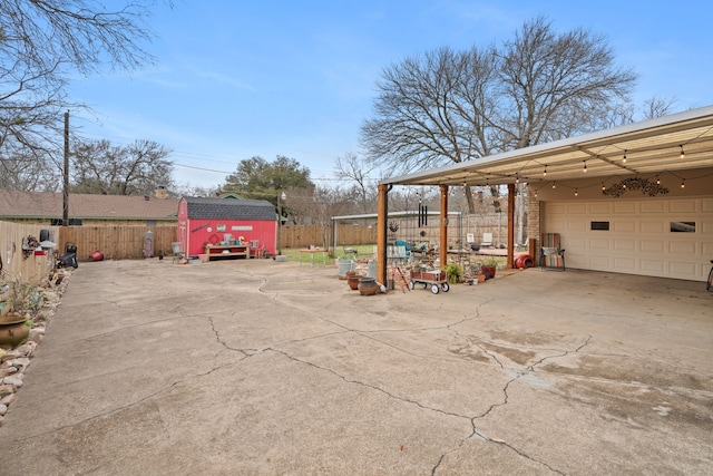 exterior space featuring a garage and a storage unit