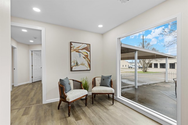 sitting room with hardwood / wood-style floors