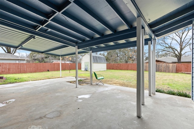 view of patio featuring a shed