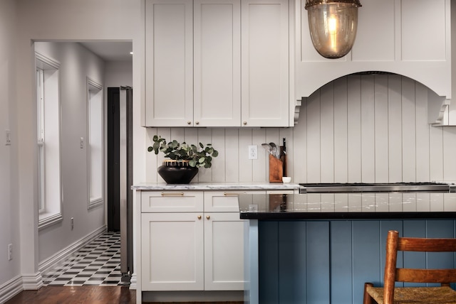 kitchen with stainless steel gas cooktop and white cabinets