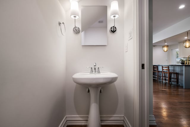 bathroom with wood-type flooring