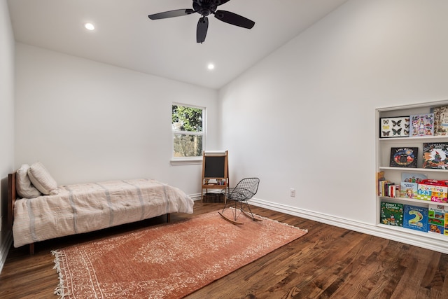 bedroom with dark wood-type flooring, vaulted ceiling, and ceiling fan