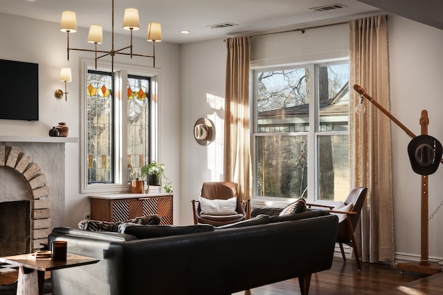 sitting room with dark hardwood / wood-style floors and a wealth of natural light