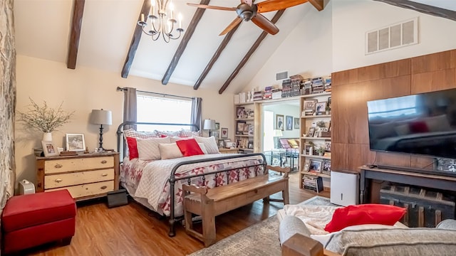 bedroom with beamed ceiling, a notable chandelier, high vaulted ceiling, and light hardwood / wood-style flooring