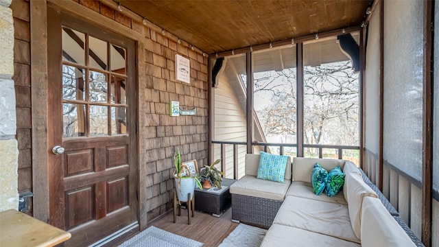 sunroom featuring wooden ceiling