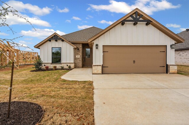 729 Jameson, Springtown, TX 76082 - view of front of property featuring board and batten siding, a shingled roof, concrete driveway, a garage, and brick siding