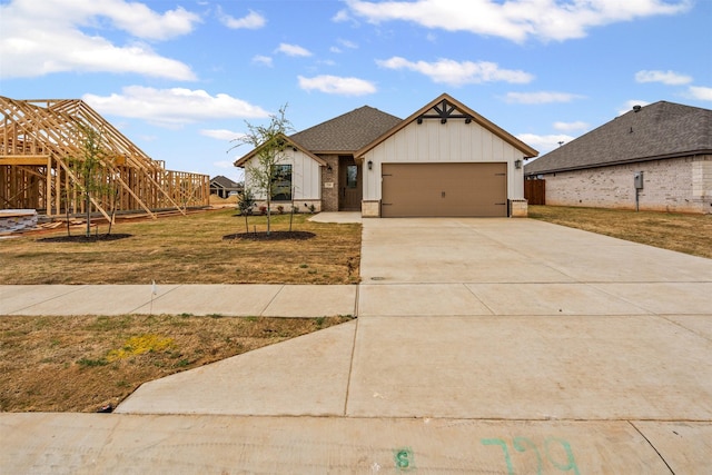 729 Jameson, Springtown, TX 76082 - view of front of house with a garage, driveway, a front yard, and board and batten siding