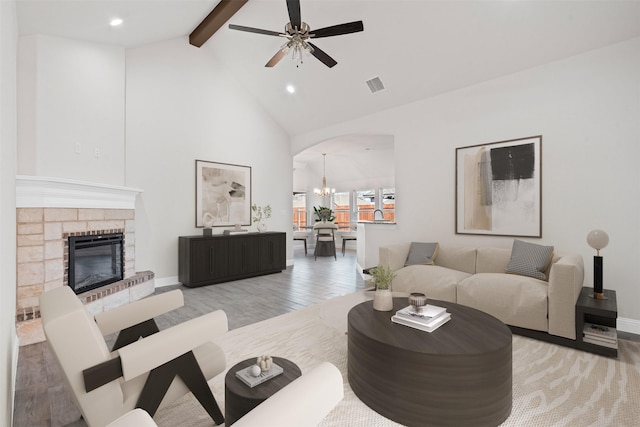 729 Jameson, Springtown, TX 76082 - living room with beamed ceiling, arched walkways, a ceiling fan, a chandelier, and recessed lighting