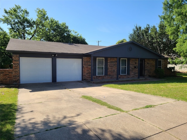 ranch-style house with a garage and a front lawn