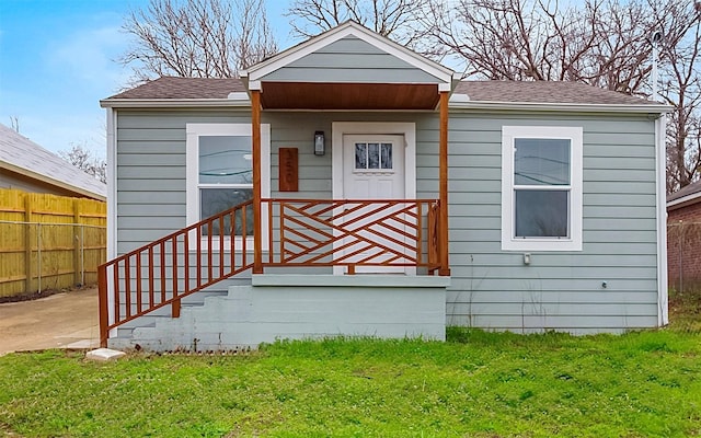 bungalow with a front lawn