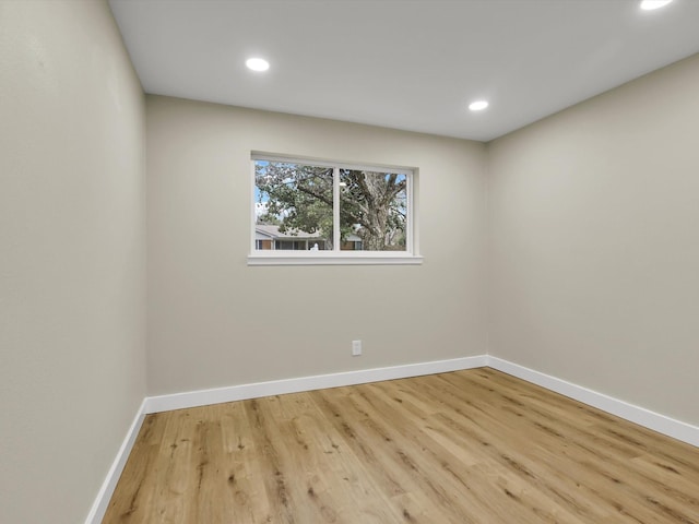 spare room featuring light hardwood / wood-style flooring