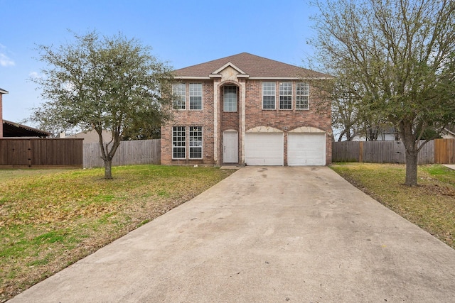 view of front of house with a garage and a front lawn