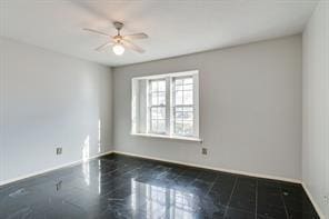 unfurnished room featuring ceiling fan