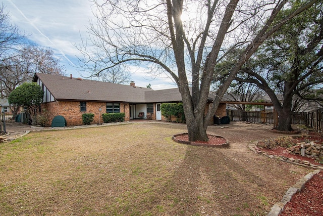 ranch-style home with a front yard