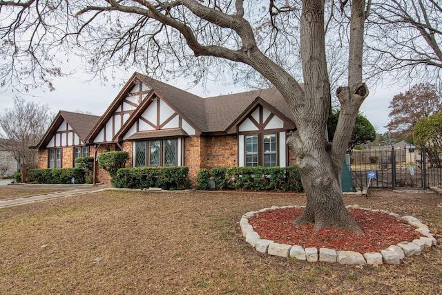 tudor house with a front yard