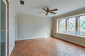 unfurnished room featuring ornamental molding, light tile patterned floors, and ceiling fan