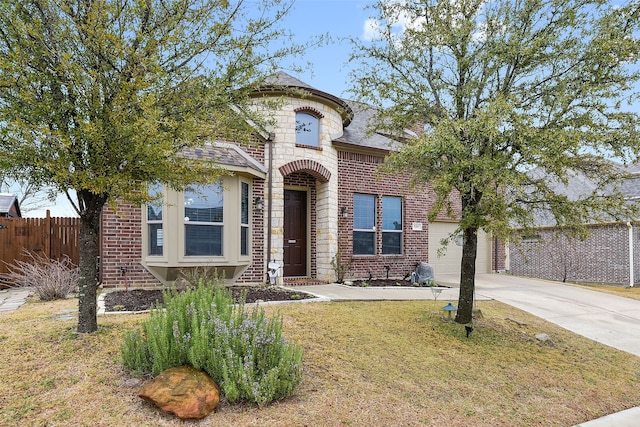 view of front of property featuring a garage and a front yard