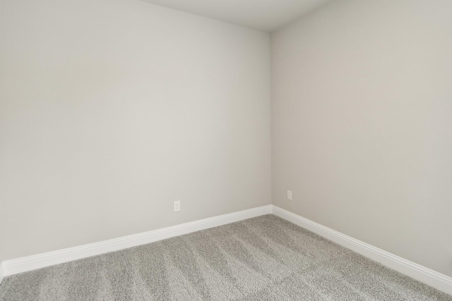 212 Navajo Trl, Alvarado, TX 76009 - unfurnished room with baseboards and light carpet