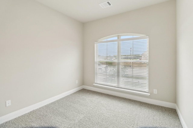 212 Navajo Trl, Alvarado, TX 76009 - spare room with visible vents, carpet, and baseboards