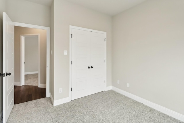 212 Navajo Trl, Alvarado, TX 76009 - unfurnished bedroom with carpet flooring, baseboards, and a closet