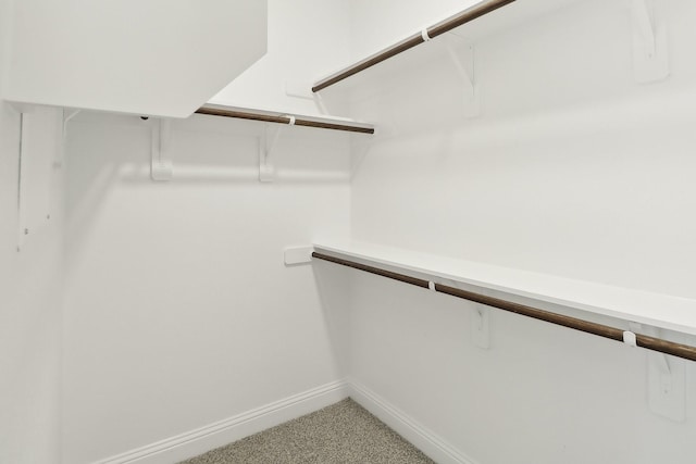 212 Navajo Trl, Alvarado, TX 76009 - walk in closet featuring light colored carpet