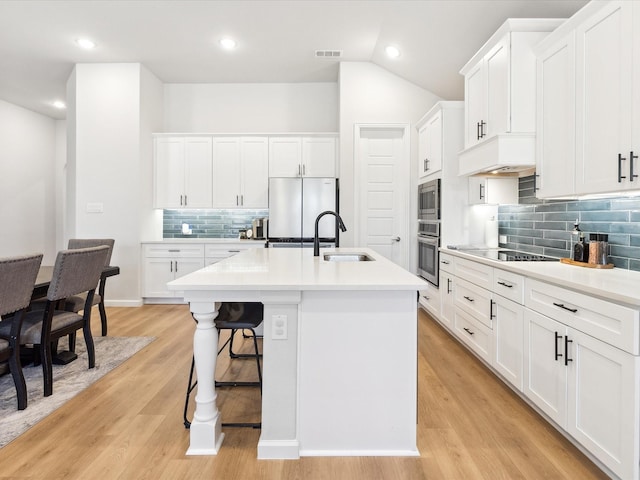 2019 Atlantic Ave, Anna, TX 75409 - kitchen with visible vents, decorative backsplash, a kitchen island with sink, a sink, and appliances with stainless steel finishes
