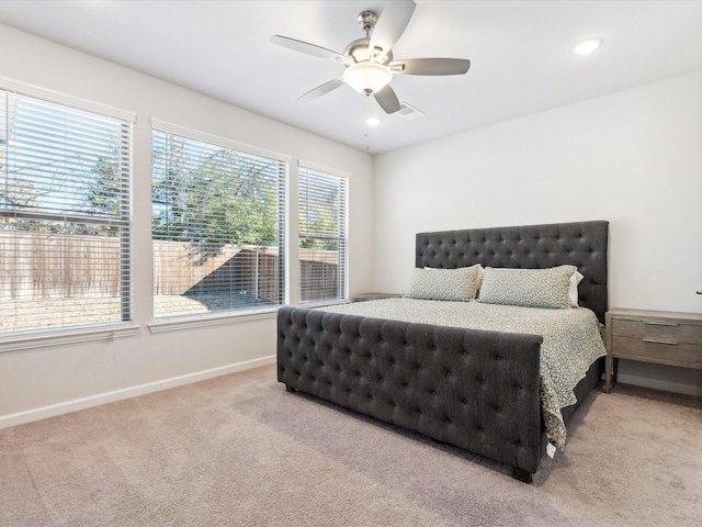 bedroom featuring ceiling fan and light colored carpet