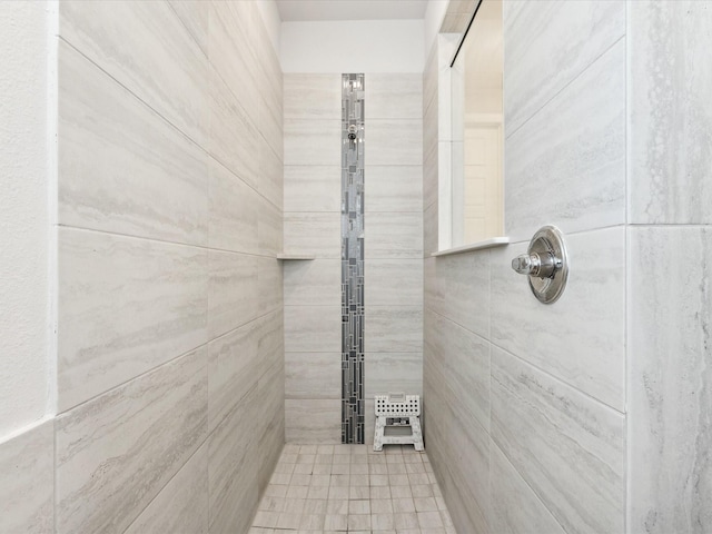 bathroom with tiled shower