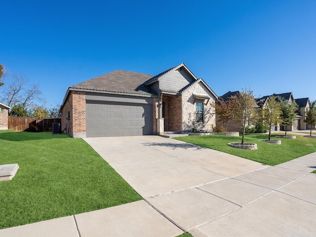 ranch-style house featuring a garage, central air condition unit, and a front lawn