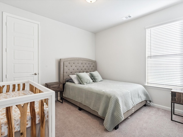 bedroom with light carpet