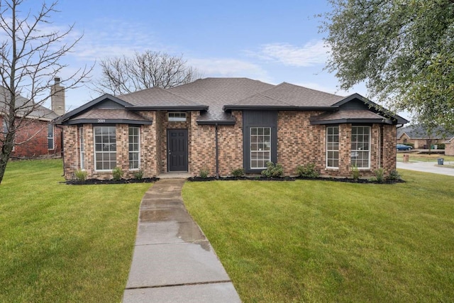 view of front of property with a front lawn