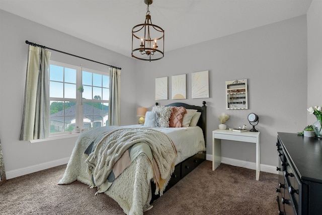 carpeted bedroom with a notable chandelier