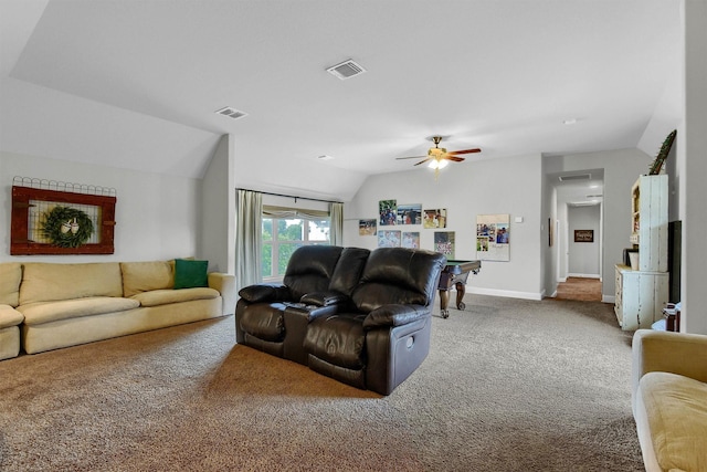 carpeted living room featuring ceiling fan and lofted ceiling