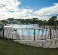 view of swimming pool featuring a water view