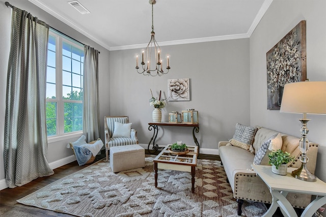 living area featuring an inviting chandelier, ornamental molding, and dark hardwood / wood-style floors