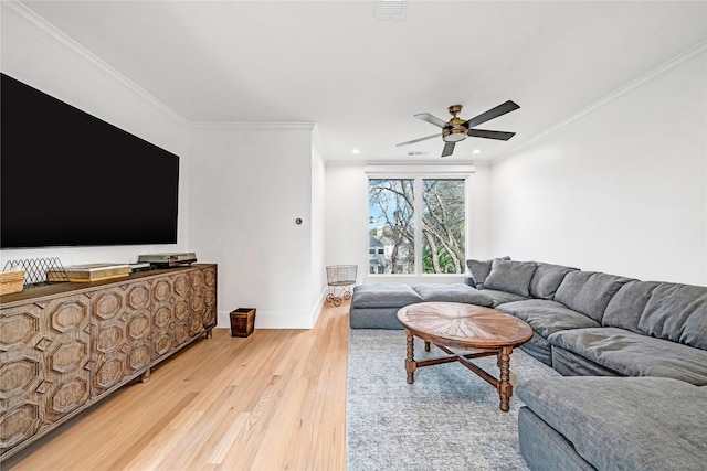 living room with ceiling fan, light hardwood / wood-style flooring, and crown molding