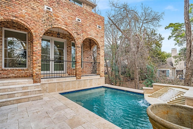 view of pool featuring a patio and pool water feature