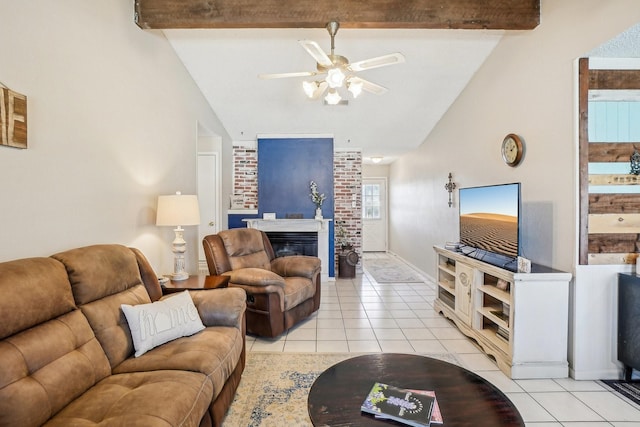 living room with light tile patterned floors, lofted ceiling with beams, and a fireplace