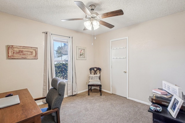 office with carpet flooring, ceiling fan, a textured ceiling, and baseboards