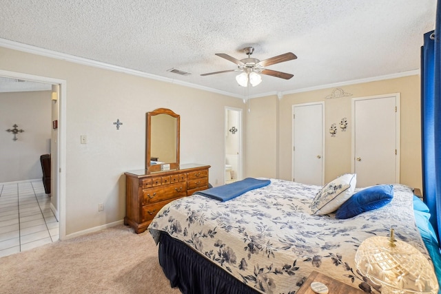 bedroom with visible vents, ornamental molding, and light colored carpet