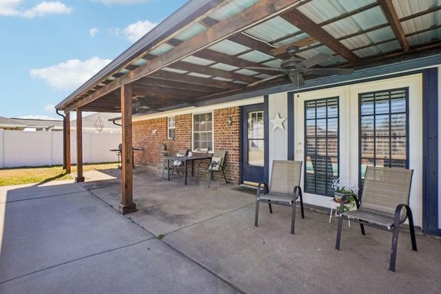 view of patio / terrace featuring a ceiling fan and fence