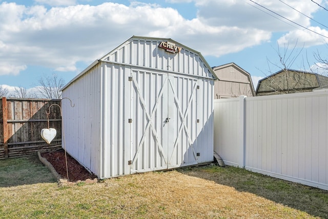 view of shed featuring a fenced backyard