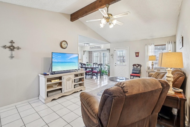 living area featuring a wealth of natural light, light tile patterned flooring, vaulted ceiling with beams, and ceiling fan