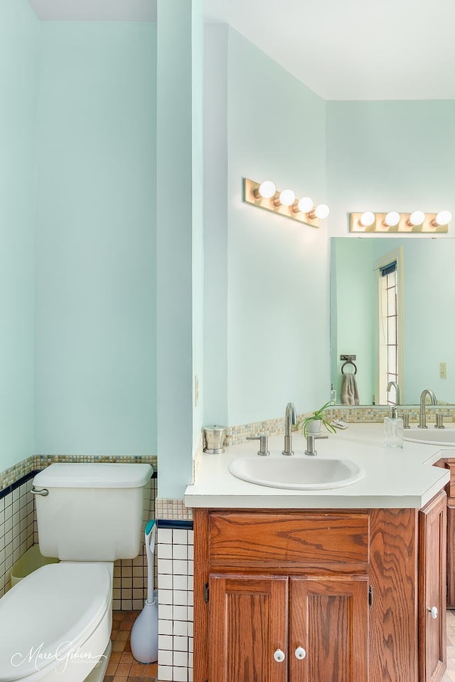 bathroom with vanity and toilet