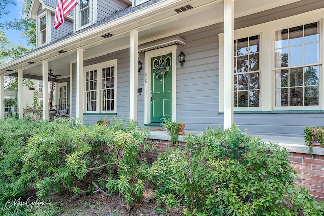 doorway to property featuring covered porch