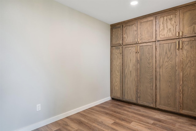 unfurnished bedroom featuring wood-type flooring