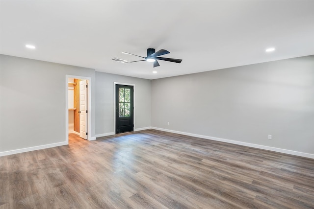 unfurnished room with ceiling fan and hardwood / wood-style floors