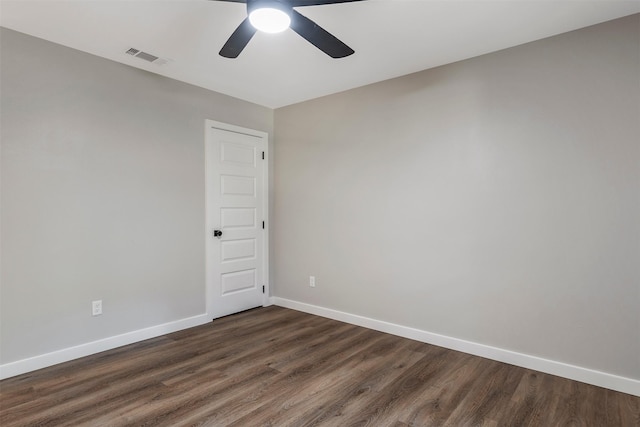 empty room with dark wood-type flooring and ceiling fan